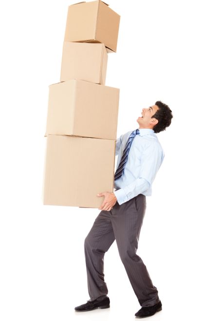 Businessman carrying heavy boxes - isolated over a white background