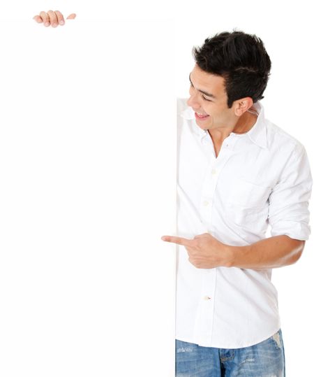 Surprised man pointing at a banner - isolated over a white background