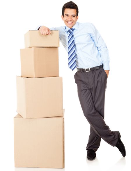 Businessman packing in carton boxes and getting ready for moving - isolated