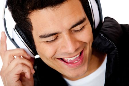 Male DJ singing and wearing headphones - isolated over a white background