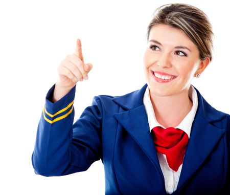 Air hostess pointing with finger Ã?Â¢?? isolated over a white background