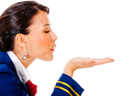 Flight attendant blowing into her hand - isolated over white