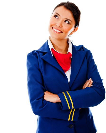 Thoughtful flight attendant looking up - isolated over a white background