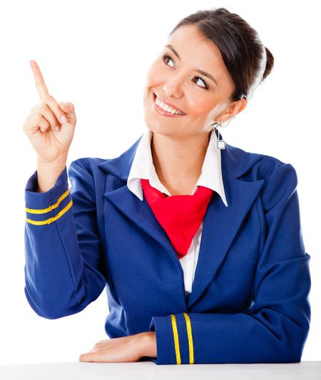 Air hostess pointing with finger Ã?Â¢?? isolated over a white background