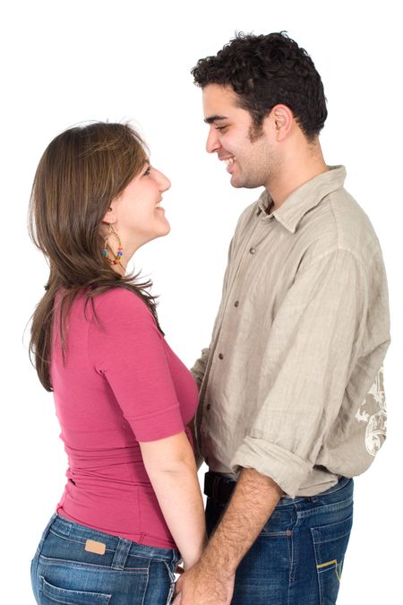 happy couple of young adults portrait smiling isolated over a white background