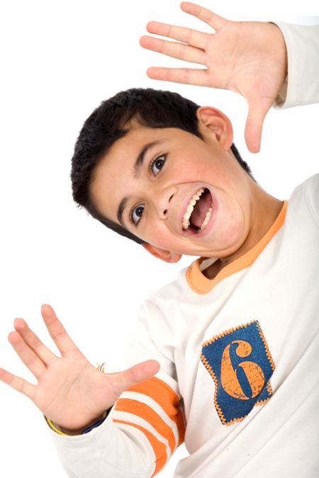 kid smiling and framing his face isolated over a white background