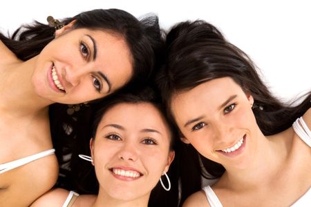 female friends smiling isolated over a white background