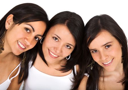 female friends smiling and dressed in white clothes isolated