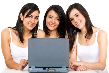 female friends on a laptop computer smiling and isolated over a white background
