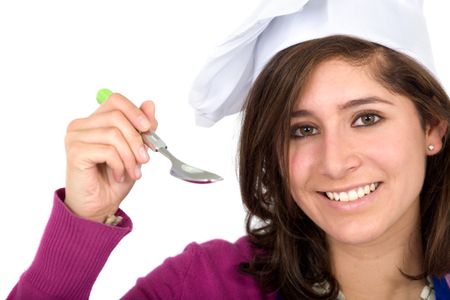 female chef with a spoon isolated over a white background