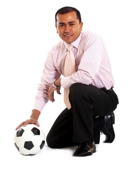 business man with a football isolated over a white background
