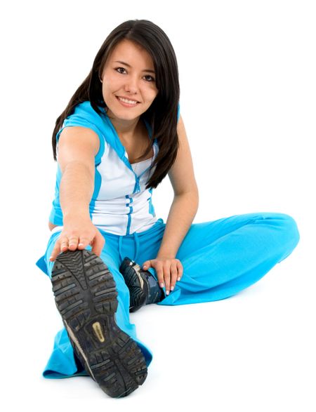woman doing exercise smiling isolated over a white background