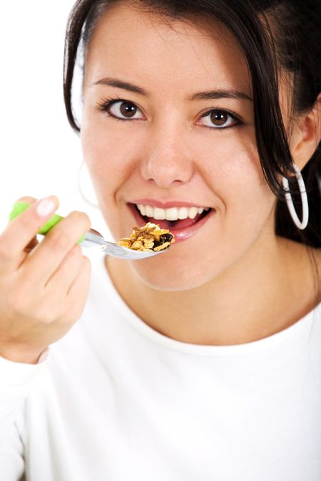 girl eating cereal isolated over a white background