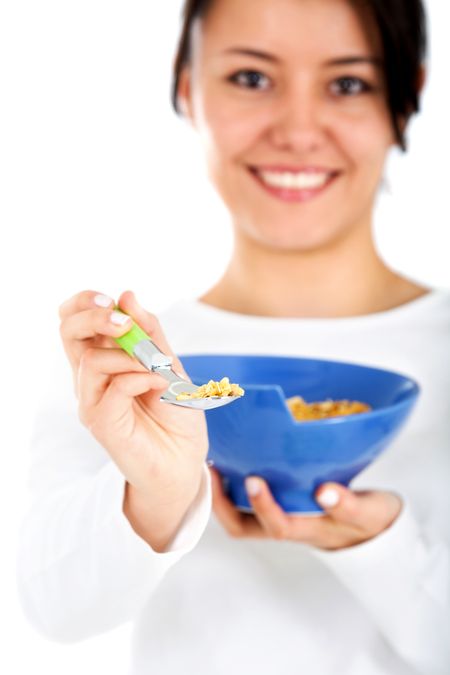 woman eating cereal isolated over a white background