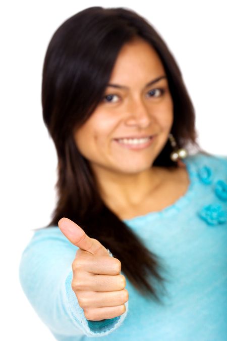 woman doing the thumbs up sign isolated over a white background