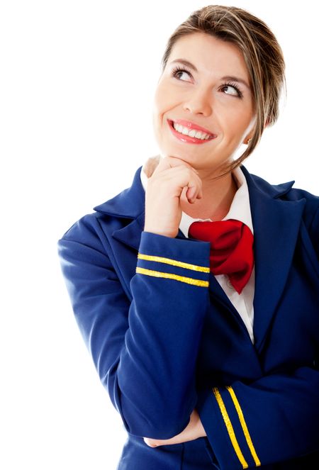 Pensive flight attendant looking up - isolated over a white background