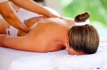Woman at the spa getting a back massage