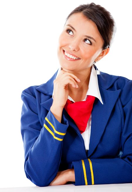 Pensive flight attendant looking up - isolated over a white background