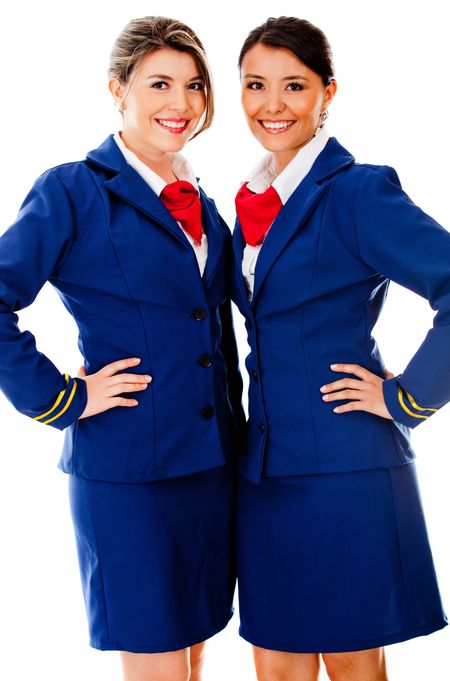 Beautiful air hostesses smiling - isolated over a white background