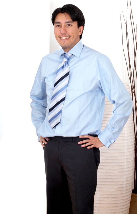 confident hispanic business man portrait in an office