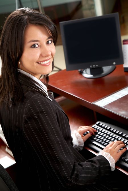 Business woman portrait smiling in an office - hispanic