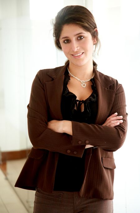 business-woman-portrait-smiling-office-9791260 business woman portrait smiling in an office