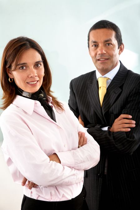 Business partners smiling in an office - man and woman