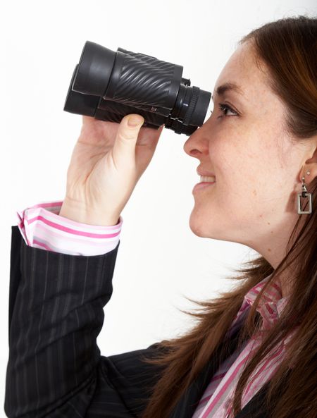 business woman searching using her binoculars isolated over a white background