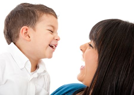 Portrait of a happy mother and son laughing - isolated over a white background
