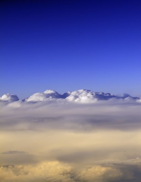 Realm of dreams: Upper clouds and deep blue sky seen from 35,000 feet or higher near sunset