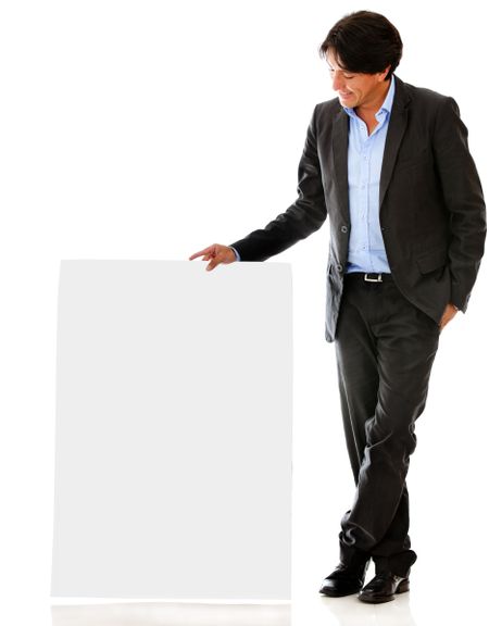Businessman looking at a banner - isolated over a white backgorund