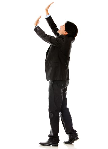 Business man lifting an imaginary object - isolated over a white background