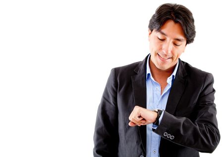 Businessman checking the time on his watch - isolated ove a hwite background