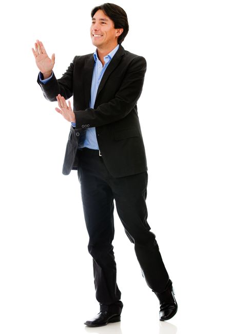 Businessman pushing with his hands - isolated over a white background