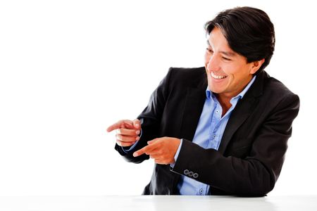 Happy business man pointing - isolated over a white background