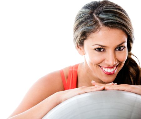 Woman portrait with a pilates ball - isolated oer a white backgorund